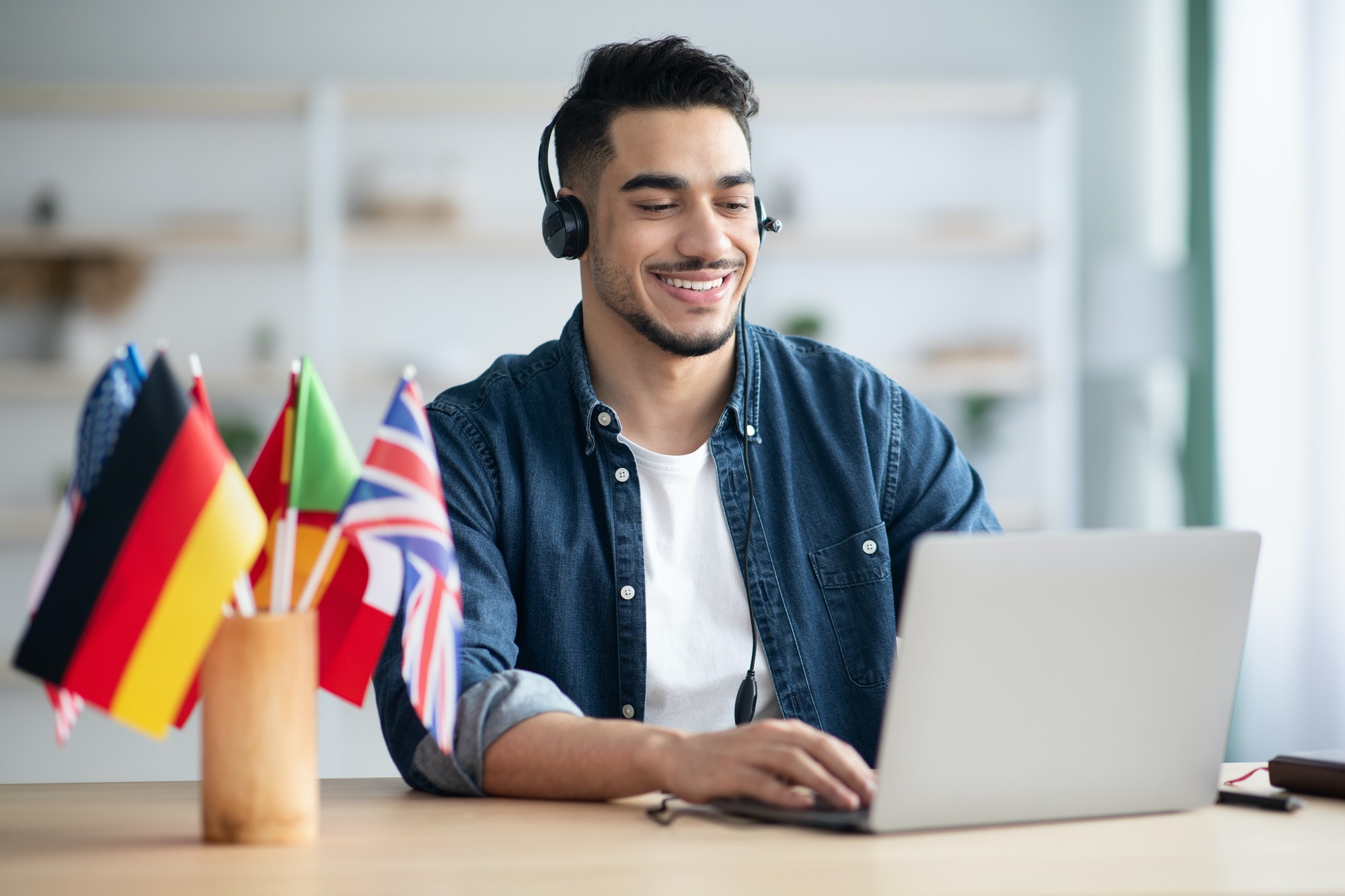 happy-arab-guy-student-learning-foreign-language-online-1.jpg